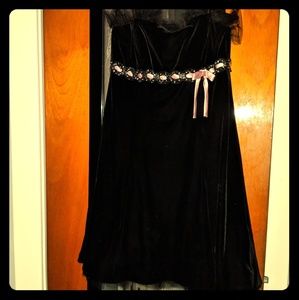 Black velvet dress with pink ribbon embellishment